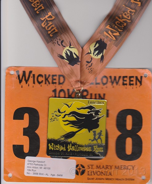 2013 Wicked 10K 215.jpg - The finisher's medal. Spooky!